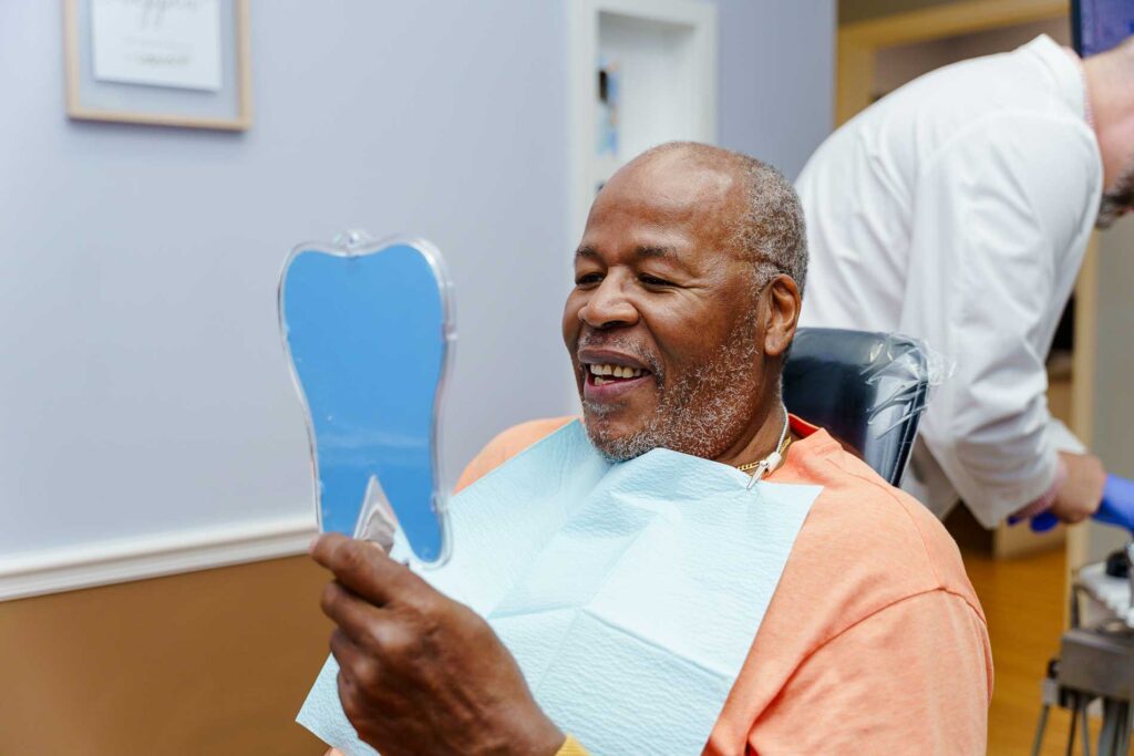 Bayway Dental Impant Patient looking in the mirror