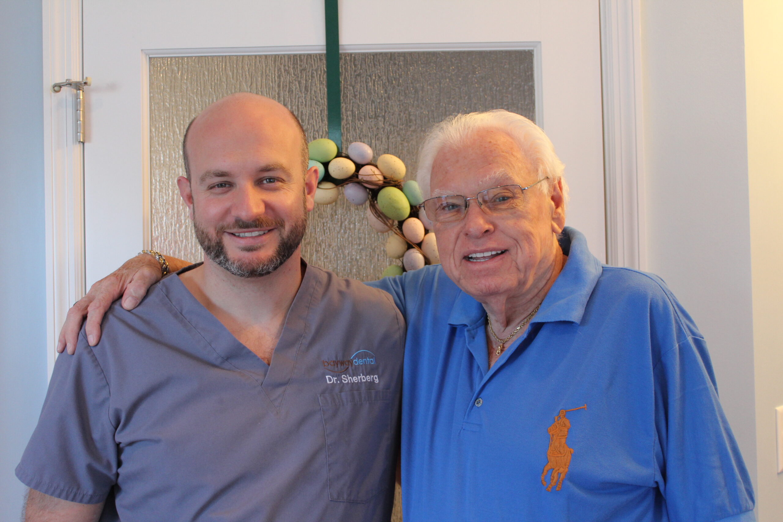 Dr. Sherberg with a happy dental implant patient DRS w ELI scaled